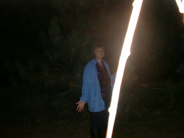 Caryl heard "Bring in the Spirit of the Tree". Notice the light goes right through her hand where she was holding a branch of the tree behind me. Colorado, 1997